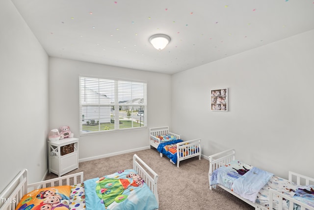 bedroom featuring carpet flooring, visible vents, and baseboards