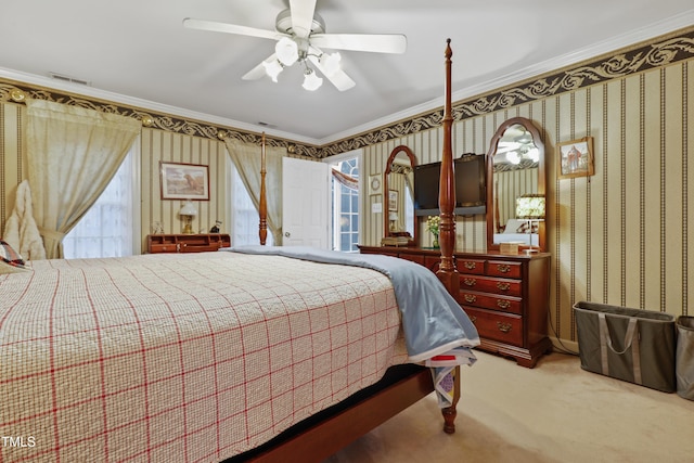 bedroom featuring visible vents, wallpapered walls, ceiling fan, ornamental molding, and light colored carpet