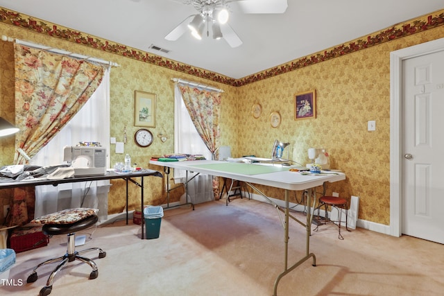 office featuring visible vents, wallpapered walls, and carpet