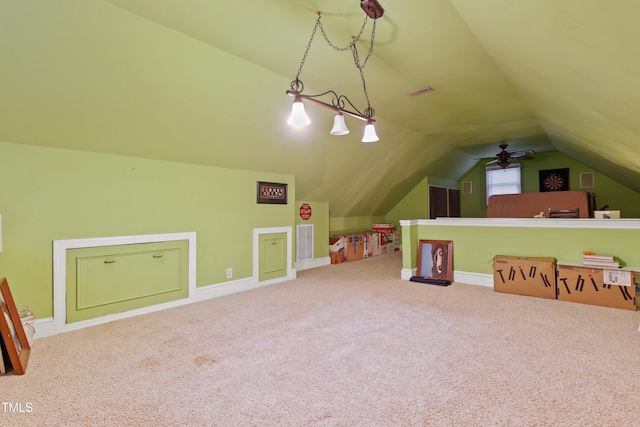 recreation room featuring visible vents, baseboards, lofted ceiling, and carpet floors