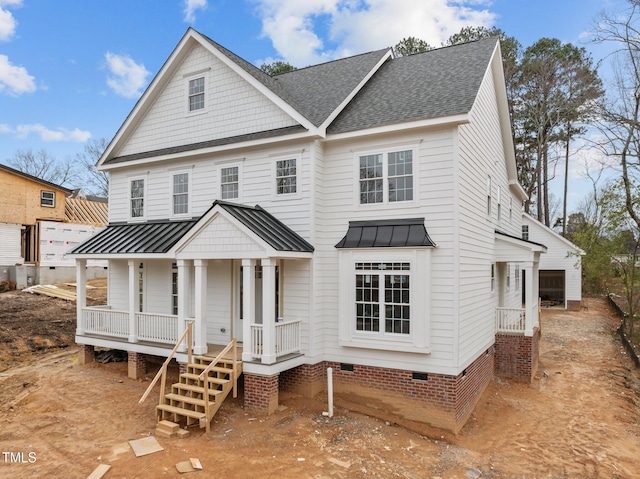 view of front of house with crawl space, covered porch, a standing seam roof, and roof with shingles