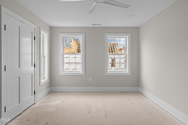 unfurnished bedroom featuring visible vents, baseboards, and ceiling fan