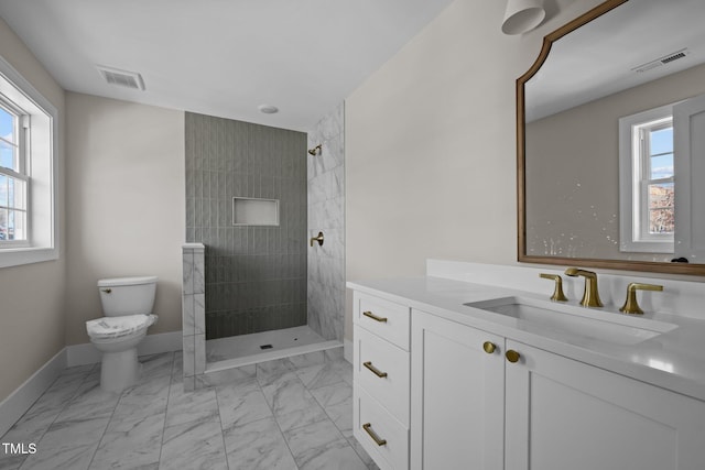 full bathroom with toilet, visible vents, marble finish floor, and tiled shower