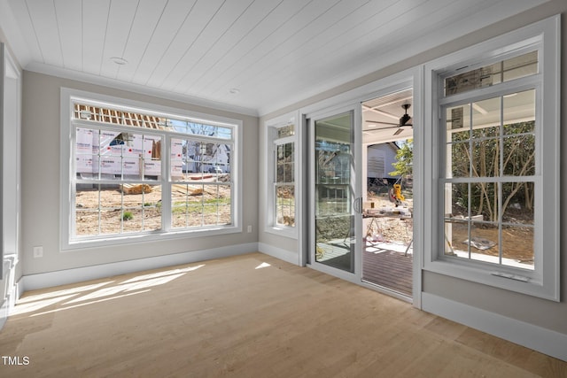 unfurnished sunroom with wood ceiling