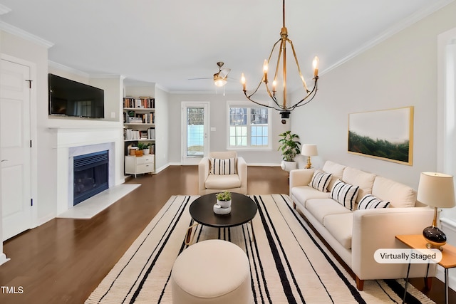 living room featuring crown molding, baseboards, a fireplace with raised hearth, and wood finished floors