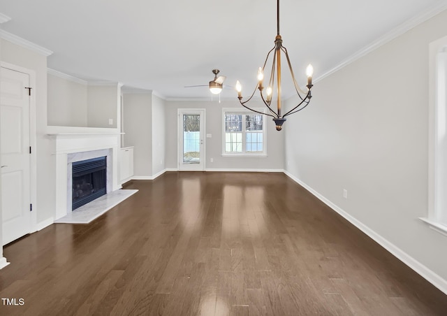 unfurnished living room featuring ornamental molding, a high end fireplace, and dark wood-style flooring