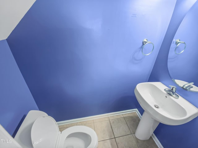 117 Woodson Dr, Clayton, NC 27527 - half bath with toilet, baseboards, and tile patterned floors