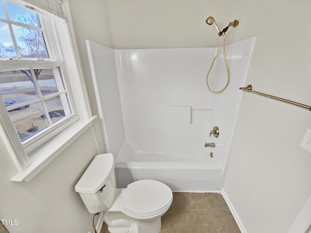117 Woodson Dr, Clayton, NC 27527 - bathroom featuring tile patterned flooring, baseboards, toilet, and shower / bathtub combination