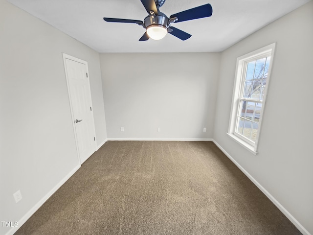 117 Woodson Dr, Clayton, NC 27527 - unfurnished room featuring baseboards, dark carpet, and ceiling fan