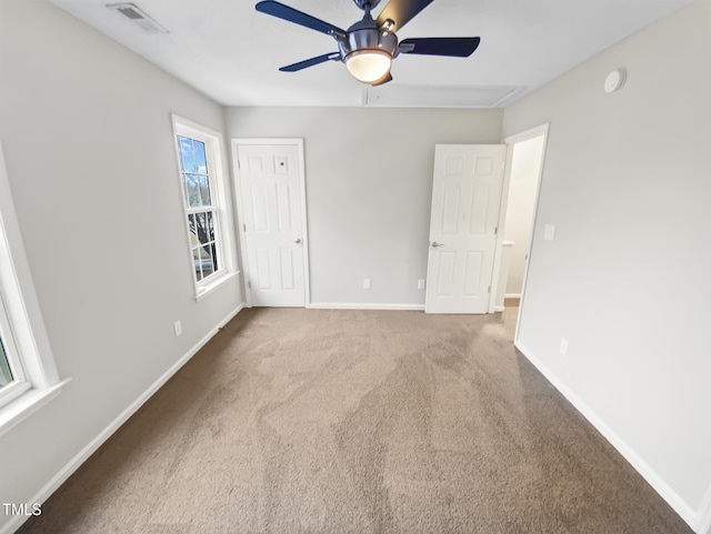 117 Woodson Dr, Clayton, NC 27527 - unfurnished bedroom featuring carpet floors, baseboards, visible vents, and ceiling fan