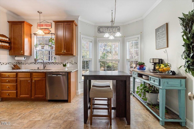 kitchen featuring a sink, tasteful backsplash, brown cabinetry, and stainless steel dishwasher