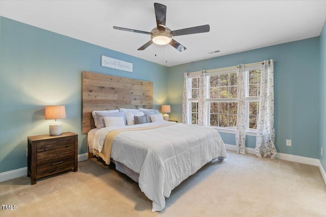 bedroom with ceiling fan, carpet flooring, visible vents, and baseboards