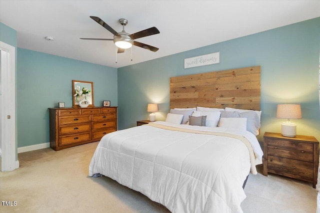 bedroom featuring baseboards, a ceiling fan, and carpet flooring