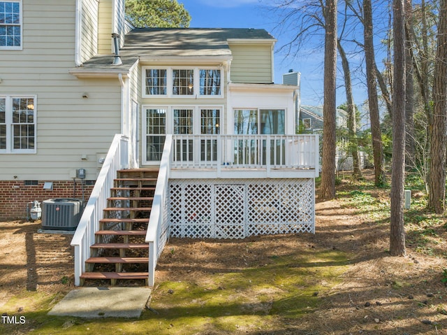 back of house with a deck, crawl space, central AC, and a chimney