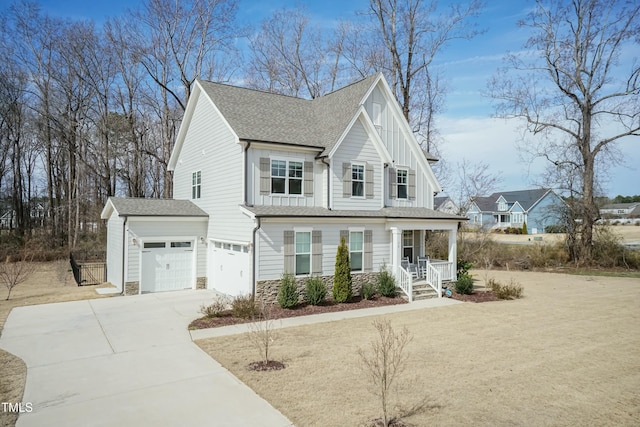 view of front facade featuring board and batten siding, concrete driveway, a shingled roof, and stone siding