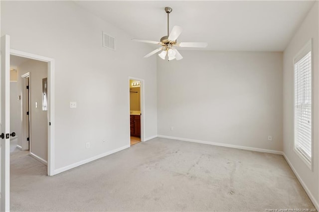 unfurnished room featuring a ceiling fan, light carpet, visible vents, and baseboards