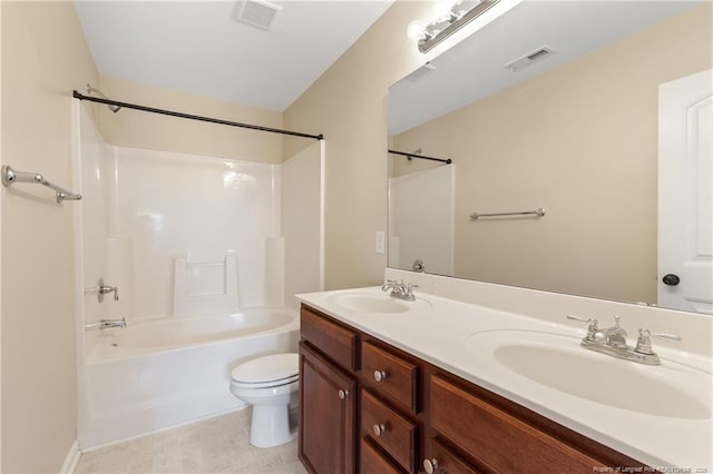 bathroom with toilet, visible vents, and a sink