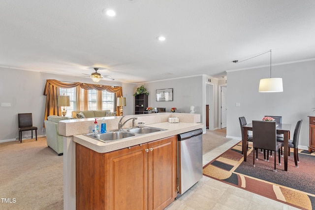 kitchen with dishwasher, open floor plan, light carpet, and a sink