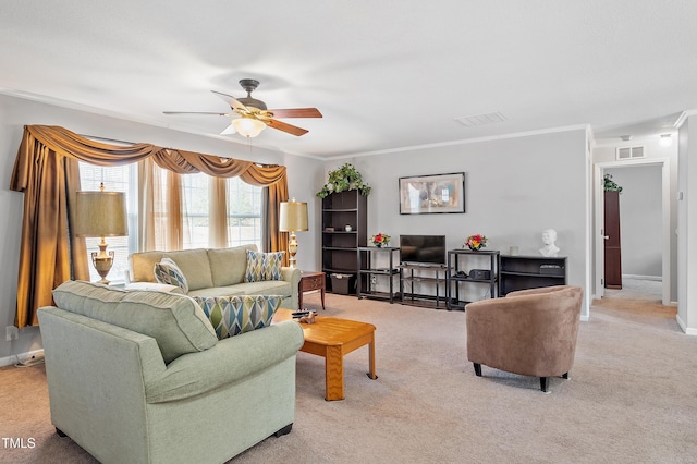 living room with light carpet, crown molding, visible vents, and a ceiling fan