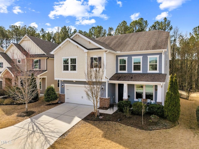 view of front of property featuring driveway, a garage, and roof with shingles