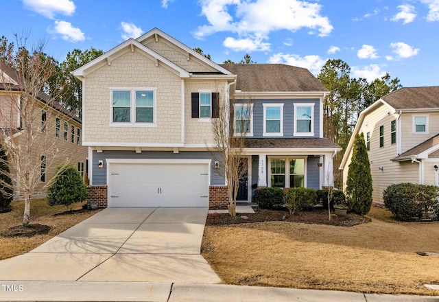 craftsman-style home featuring driveway, a garage, and brick siding