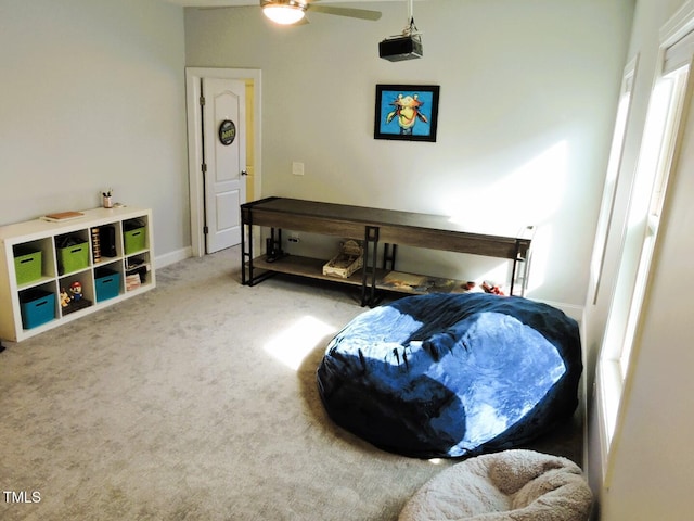 bedroom featuring ceiling fan, carpet flooring, and baseboards