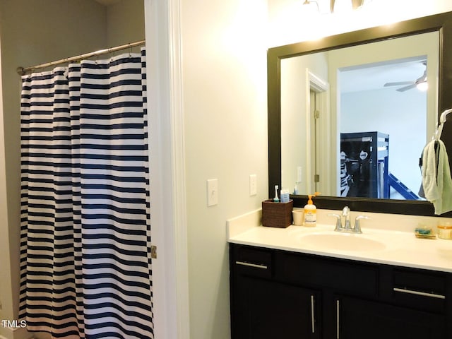 full bathroom with vanity and a shower with curtain