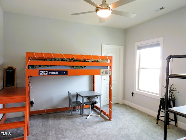 carpeted bedroom with visible vents and baseboards