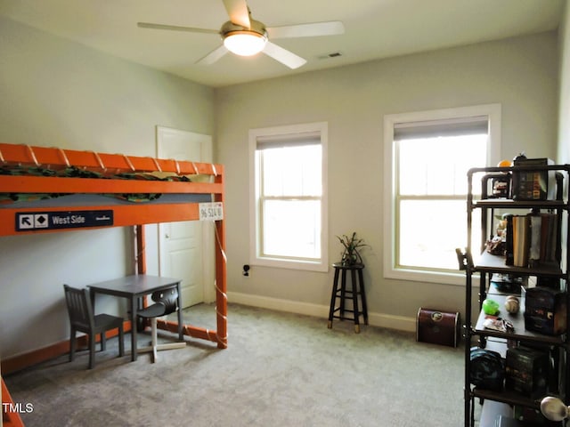 bedroom featuring carpet flooring and baseboards