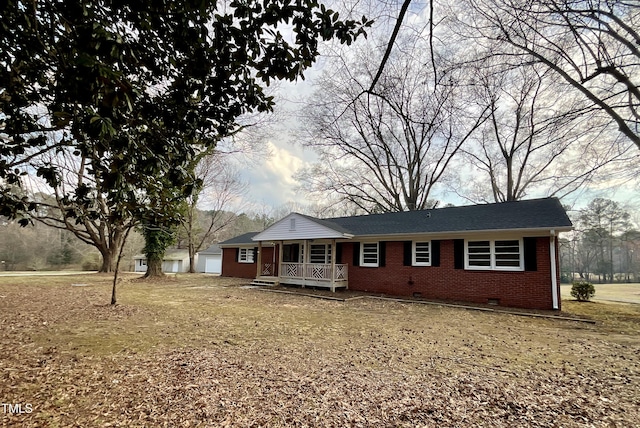 ranch-style house with a garage, brick siding, crawl space, and a porch