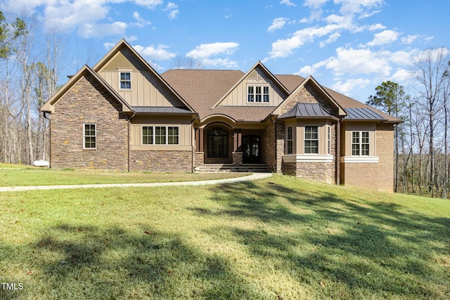 7936 NC-42, Holly Springs, NC 27540 - craftsman inspired home with a standing seam roof, a front yard, and board and batten siding