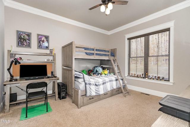 carpeted bedroom with baseboards, a ceiling fan, and crown molding