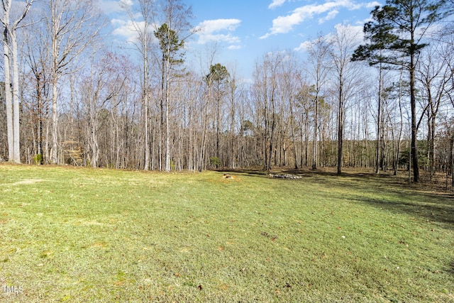 view of yard featuring a wooded view