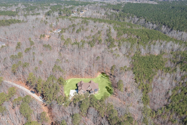 bird's eye view featuring a wooded view