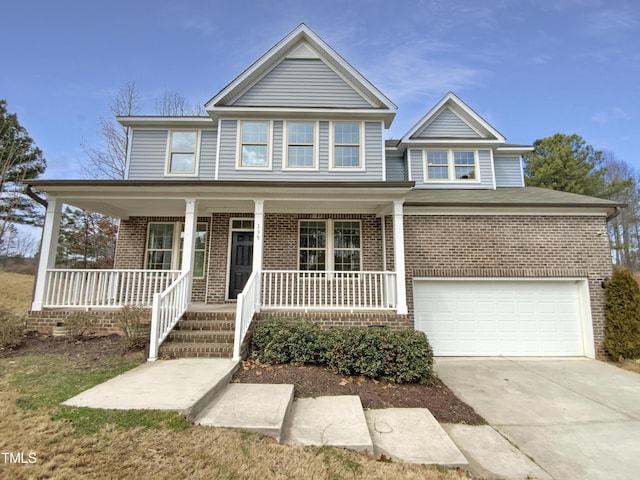 view of front of home with an attached garage, covered porch, concrete driveway, and brick siding