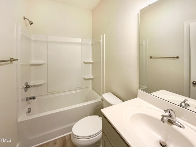 full bath with shower / tub combination, vanity, and toilet