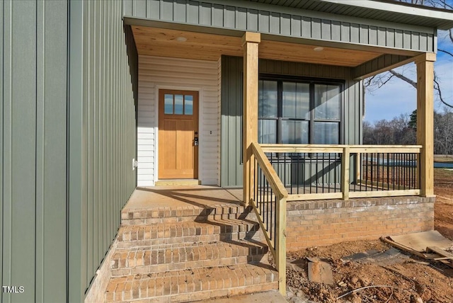 property entrance with covered porch