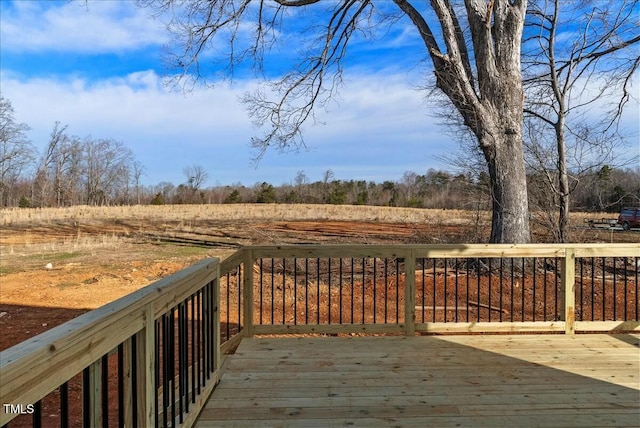 wooden terrace with a rural view