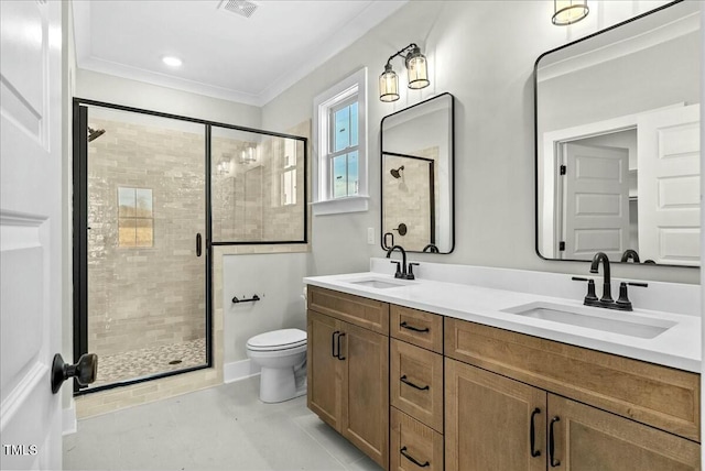 bathroom featuring a stall shower, crown molding, and a sink