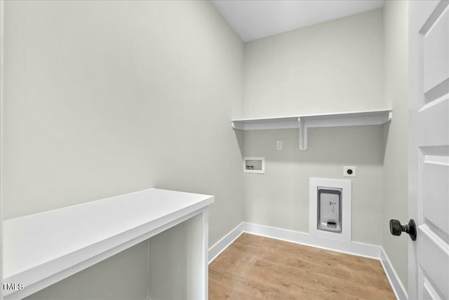 washroom featuring laundry area, baseboards, hookup for an electric dryer, light wood-type flooring, and washer hookup