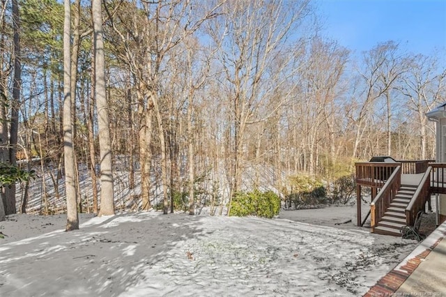 view of yard with stairway and a wooden deck