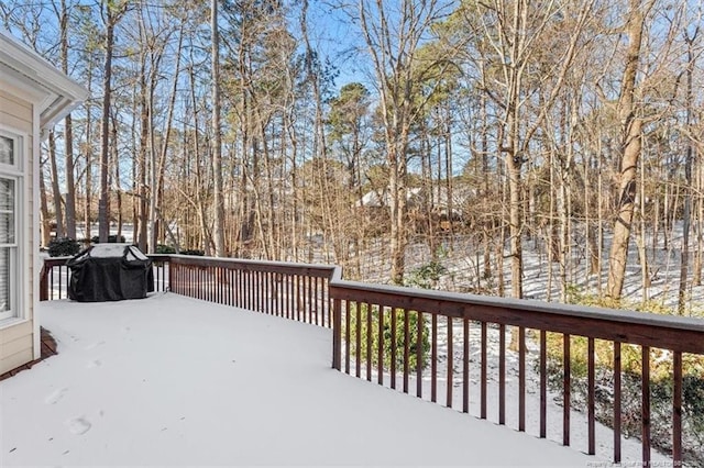 snow covered deck with grilling area