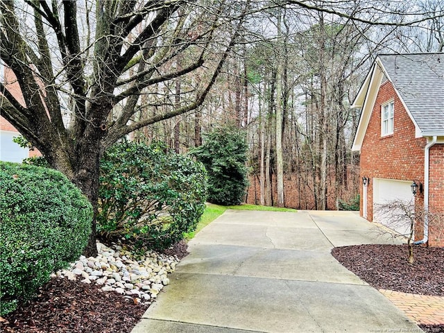 exterior space featuring driveway and a garage