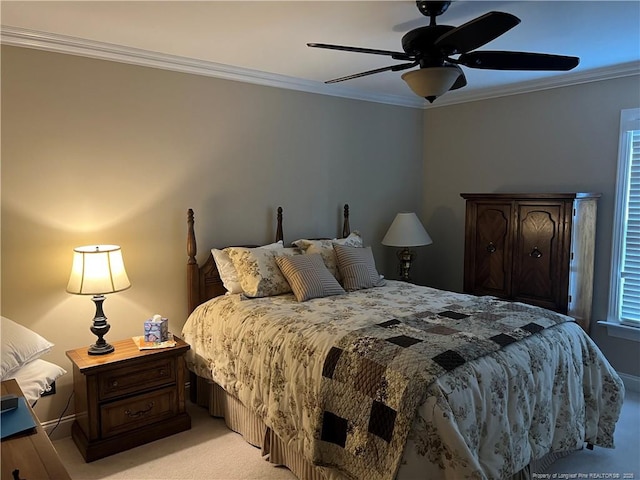 bedroom with ornamental molding, a ceiling fan, and light colored carpet