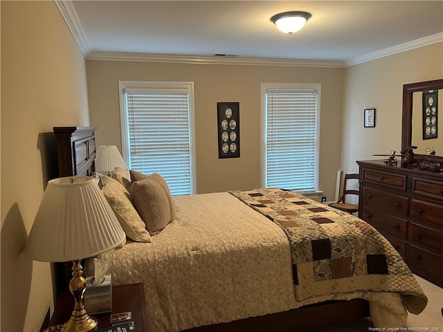 bedroom featuring visible vents and crown molding