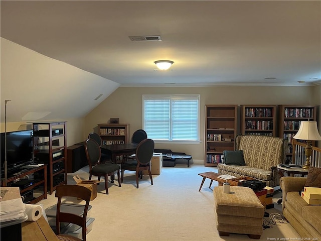 carpeted office space with lofted ceiling, visible vents, and crown molding