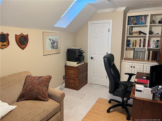 office space featuring crown molding, light colored carpet, and vaulted ceiling