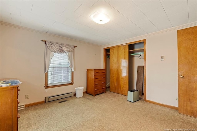 unfurnished bedroom with carpet floors, baseboards, crown molding, and baseboard heating