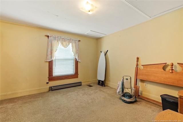 carpeted empty room with a baseboard radiator, attic access, and baseboards