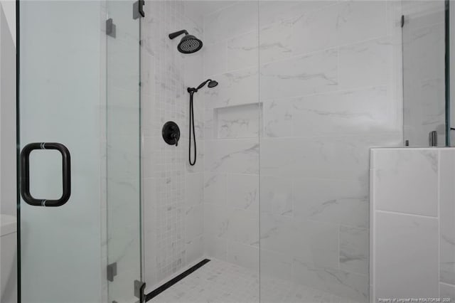 bathroom featuring a shower stall